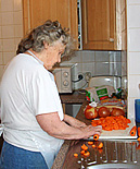 A resident preparing food in the kitchen